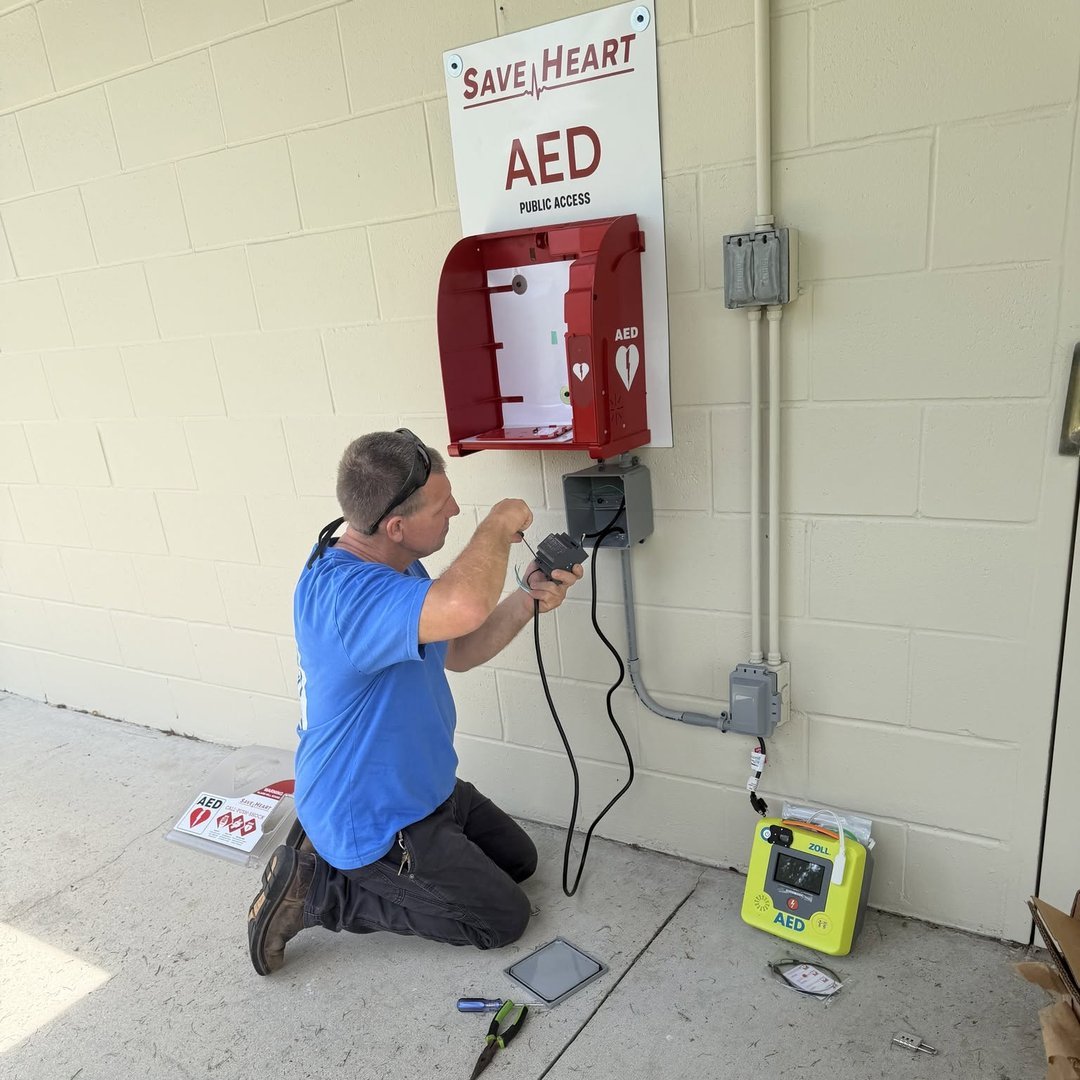 A second SaveHeart by HeartNation AED cabinet being installed at the Rolling Road Park facilities in Lady Lake