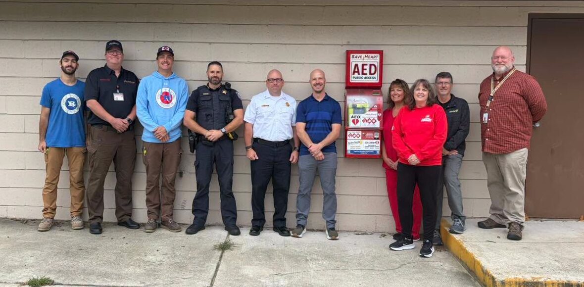 Partners from the Porter County Health Department, Portage Fire, Portage Police, Portage Parks and HEARTSafe Porter County with the new SaveHeart by HeartNation Wall-Mount at Woodland Park in Portage