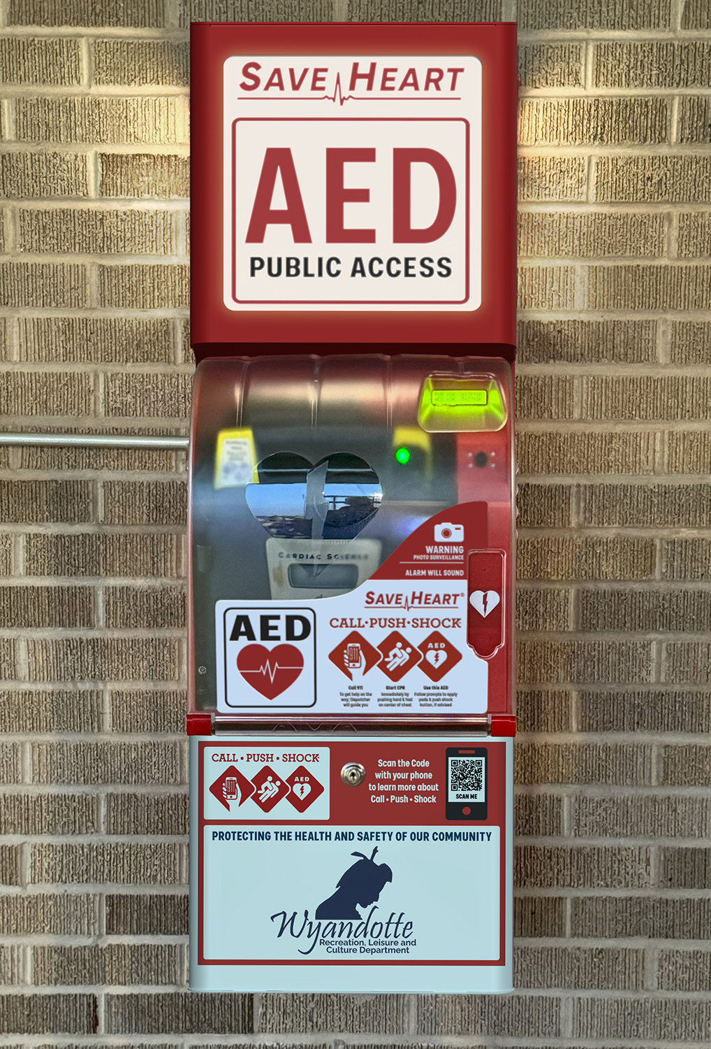 SaveHeart by HeartNation Wall-Mount AED cabinet with the Wyandotte Recreation decal at Pulaski Park in Wyandotte, Michigan